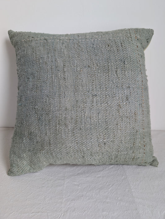 Pale green silk cushion dyed with homegrown indigo