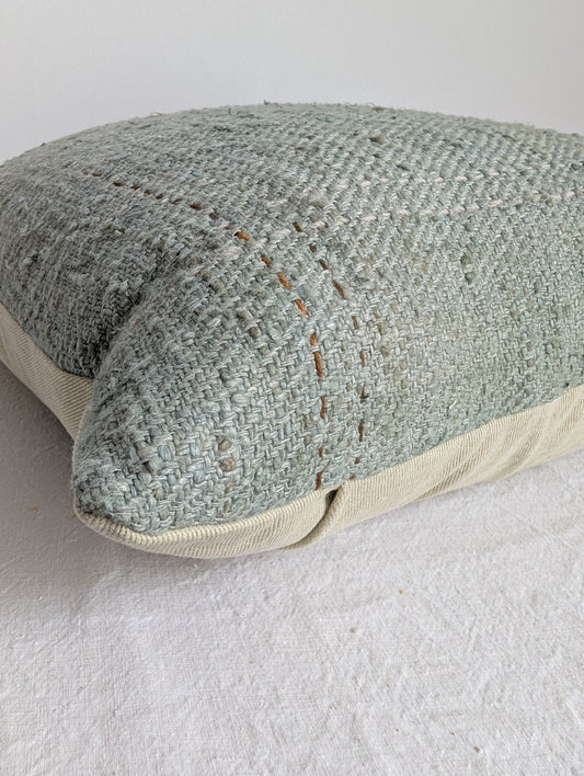 Pale green silk cushion dyed with homegrown indigo