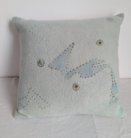 Pale green wool cushion dyed with homegrown indigo