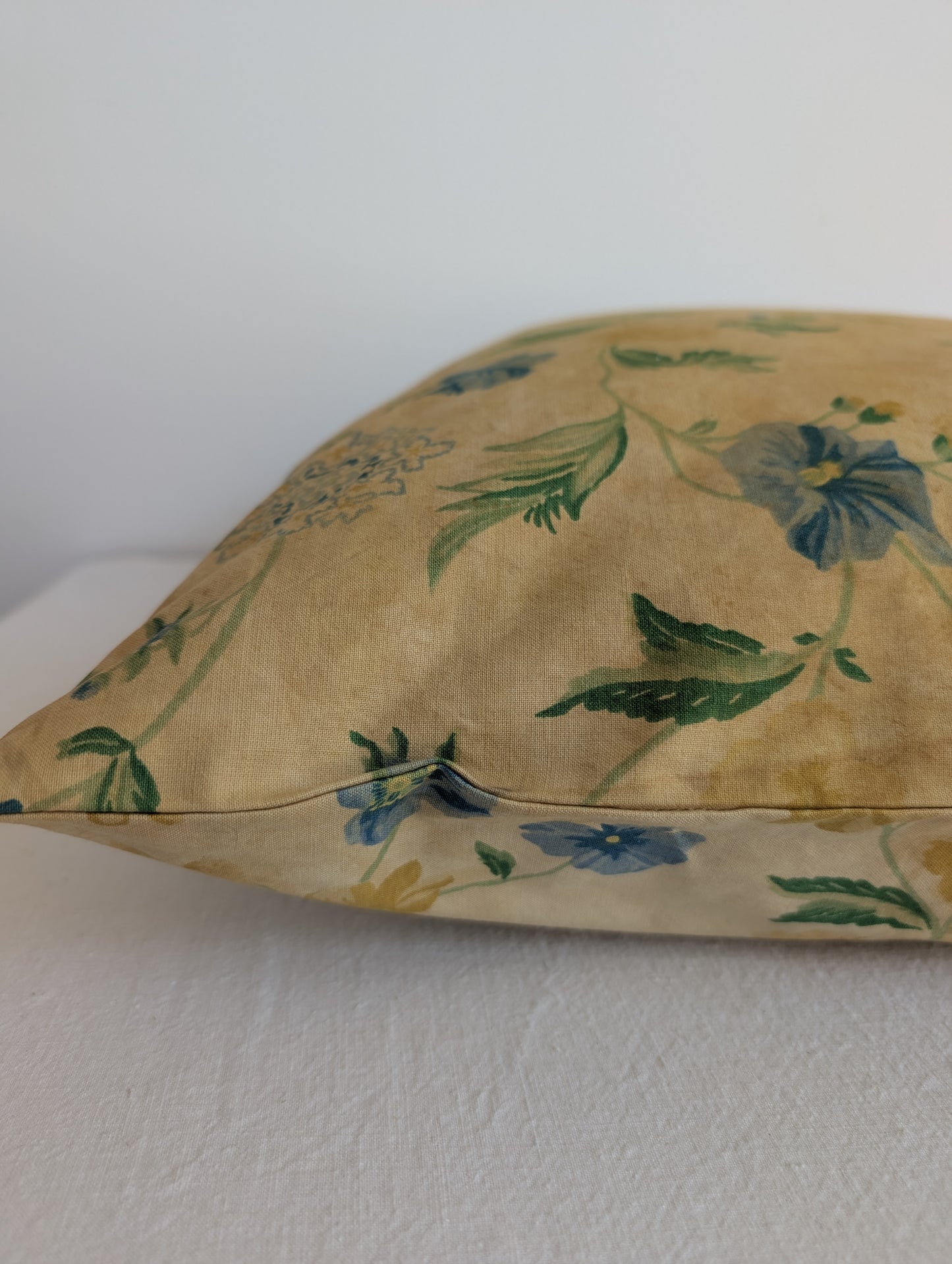 Light yellow floral cushion dyed with pomegranate