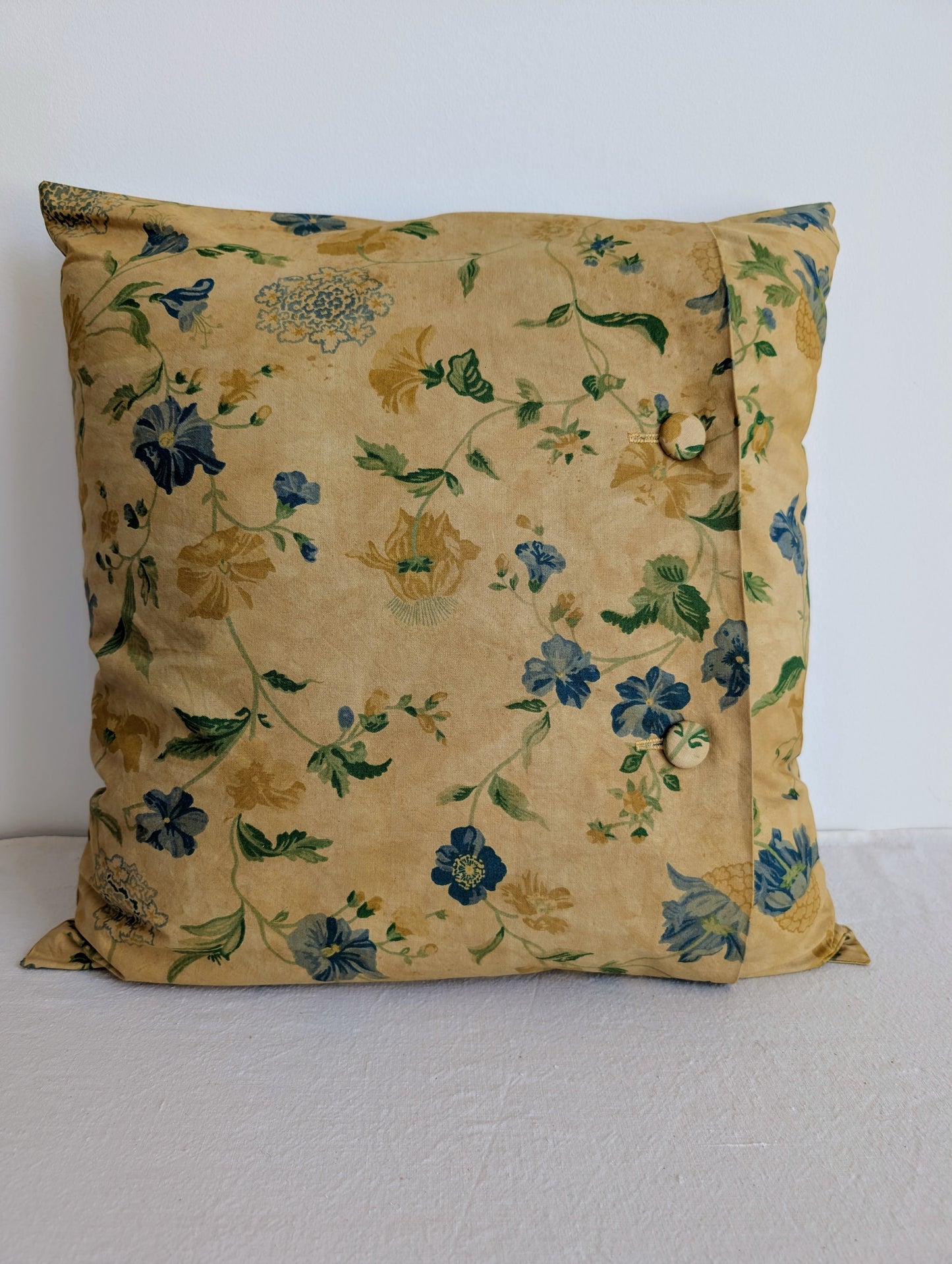 Light yellow floral cushion dyed with pomegranate