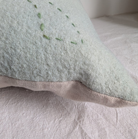 Pale green wool cushion dyed with homegrown indigo