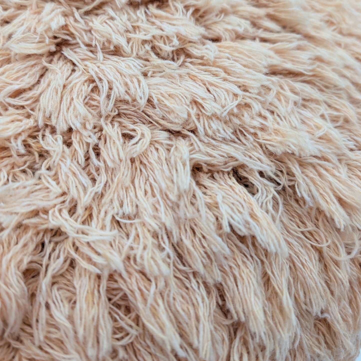 Peach wool fluffy cushion