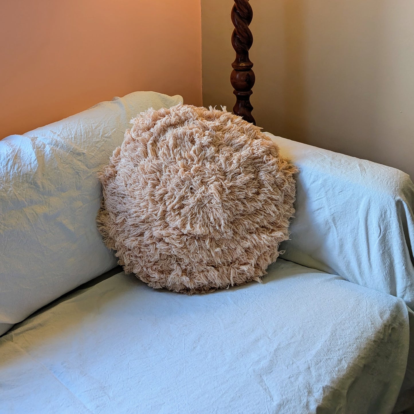 Peach wool fluffy cushion